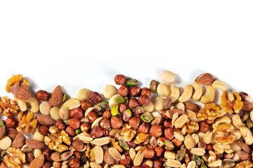 Nuts, overhead shot on a white background with copy space. A mix of peanuts, hazelnuts, walnuts,...