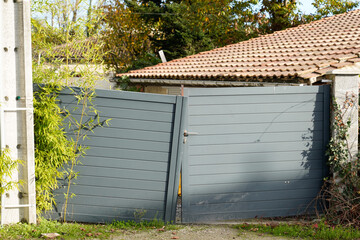 damaged steel gray street gate aluminum broken portal of suburb home