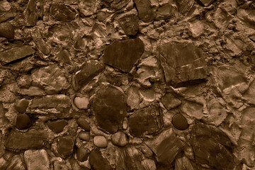 Abstract background of many large stones. Empty stone surface of dark color.