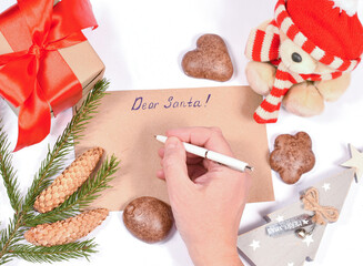 Christmas and New Year wish list, flatly. Write a letter to Santa with wishes. Blank sheet, copy space. Mock-up, Christmas composition on a white background.