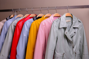 New collection of different color spring leather jackets for women. Colorful background of modern outerwear.