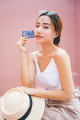 Portrait of beautiful asian woman with credit card.