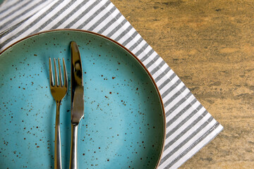 Vintage silverware on rustic wooden background. Top view of kitchen cutlery setting on grunge...