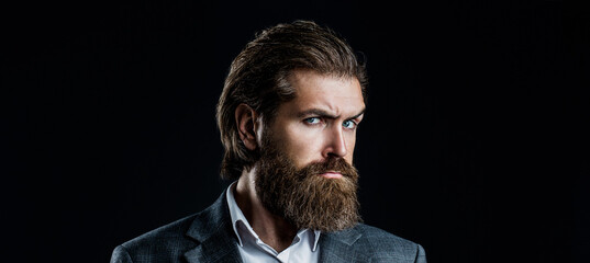 Portrait of handsome bearded man in suit. Male beard and mustache. Sexy male, brutal macho,...