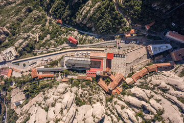 Aerial overhead drone view of Abbey of Montserrat near Barcelona in morning sunrise