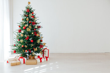 Christmas tree with gifts interior decor for the new year white background
