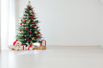 Christmas tree with gifts interior decor for the new year white background