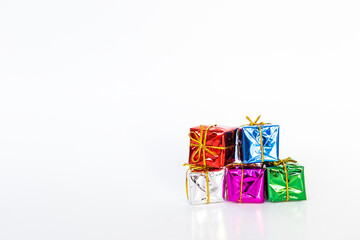 Gift box with colorful paper wrap on white background, Christmas and New year concept
