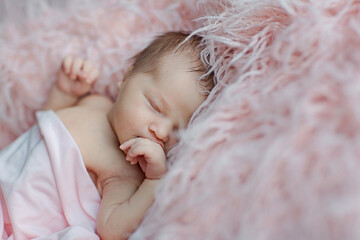 Cute newborn baby sleeping on pink blanket. Baby goods packaging template. Healthy and medical concept. Copy space
