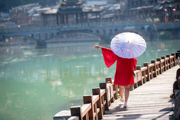 Street view local visitor and tourist atFenghuang old town Phoenix ancient town or Fenghuang County is a county of Hunan Province, China