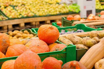 Pumpkins and other vegetables and fruits in the supermarket