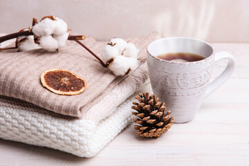Obraz na płótnie Canvas Warm winter sweaters and a cup of hot tea