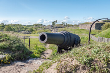 19th century cannon on the seashore in the sea fortress in Suomenlinna, Finland