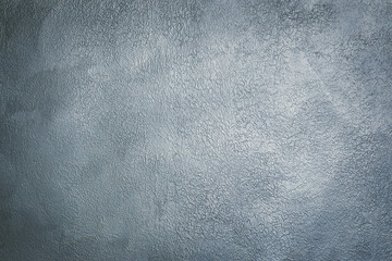 Grey textured decorative stucco for background with vignette.
