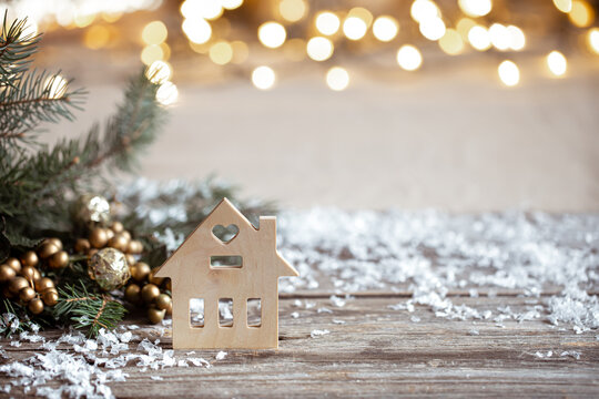 Christmas cozy background with decor details, snow and blurry lights copy space.