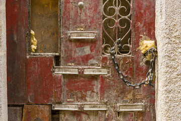 close up on letter boxes and decrepit door in the old town of Porto, Portugal

