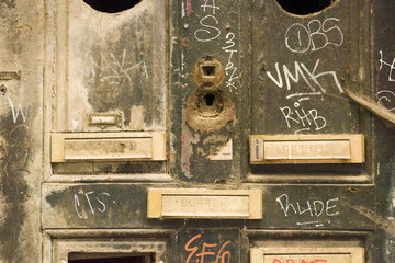 close up on letter boxes and decrepit door in the old town of Porto, Portugal

