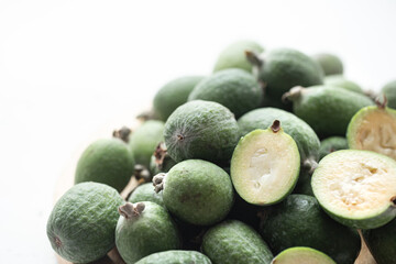 Tropical ripe feijoa fruits close up on a light background.