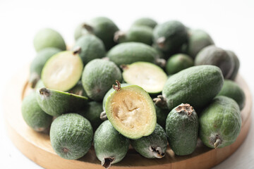 Tropical ripe feijoa fruits close up on a light background.