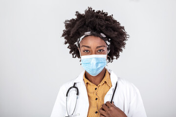 medicine, profession and healthcare concept - close up of african american female doctor or scientist in protective facial mask over grey background