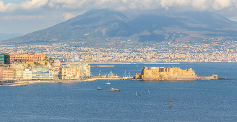 Naples, Italy - built during the 15th century, Castel dell'Ovo (Egg Castle) is a seaside castle located in the Gulf of Naples. Here the fortress with Mount Vesuvius in the background