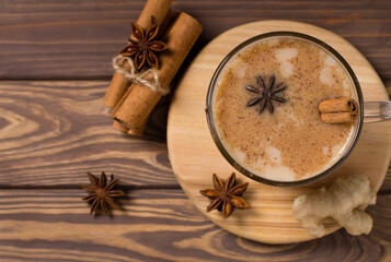 Hot masala tea with spices, cinnamon, ginger and star anise, in glass