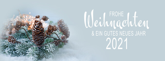 Christmas New Year greeting card 2021 with text in German - Frohe Weihnachten und ein gutes neues Jahr 2021 -Christmas winter background banner with pine cone