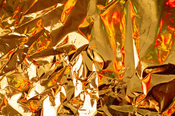 Bright holographic foil background. Bright color backdrop.