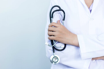 female doctor holding stethoscope