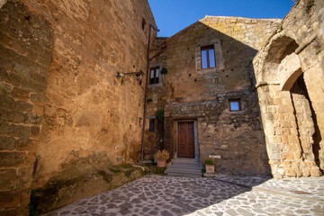 Fototapeta na wymiar Medieval houses at Civita di Bagnoregio, Italy.Spectacular Italian Villages Carved From Rock.A marvel perched on top of tuff.