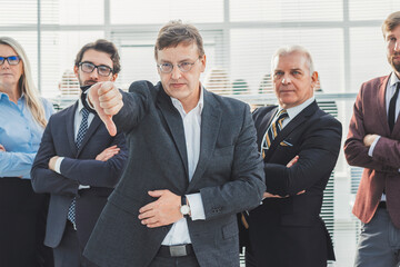 close up. angry businessman giving a thumbs down