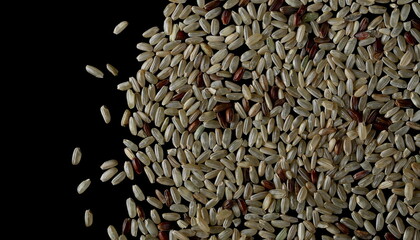 Integral rice pile isolated on black background, top view