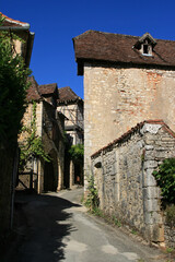 Fototapeta premium medieval houses and alley in saint-cirq-la-popie (france)