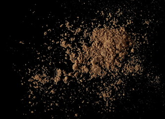 Fototapeta na wymiar Organic linseed protein powder pile isolated on black background