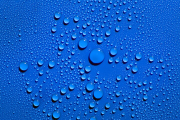 Fototapeta na wymiar Droplets on blue background