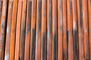 Stacked old roof tiles, detail view, usable as texture or background. High quality Photo