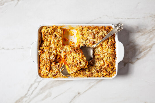 Pumpkin Dump Cake On A White Marble Background