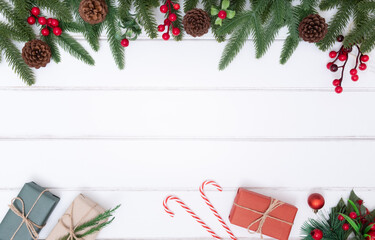 Christmas holiday and happy new year composition and decoration on white background with gift box and pine branches, flat lay, top view and copy space, for banner card