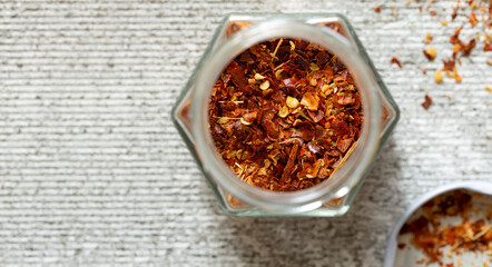 Dried hot chili peppers oriental spices close-up, top view