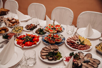 Table with a variety of food at the banquet