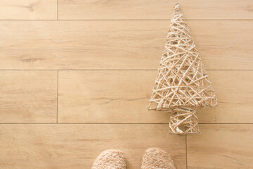 artificial rope christmas tree lying on the wood floor