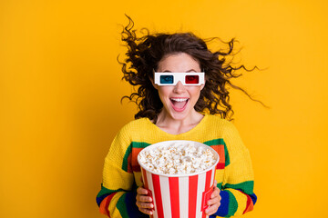 Photo of amazed funky young brunette hair lady hold popcorn watch film wear spectacles bright...