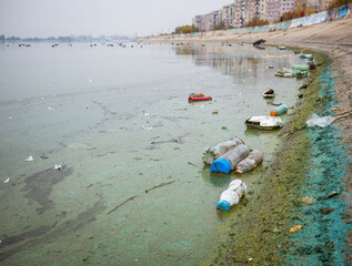 PET plastic bottles and garbage floating on the water of Dambovita lake(Lacul Morii) in Bucharest, Romania
