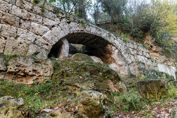 Fototapeta na wymiar ancient bridge of the bull along the black river of terni