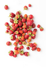 Overhead shot of fresh strawberries isolated on white background