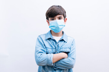 Beautiful child boy student with face mask on white background