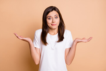 Photo portrait of clueless unsure female student shrugging shoulders wearing casual outfit isolated...