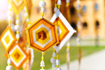 Hanging handmade hexagonal colorful knitting yarn flags. Colorful drape, Blown in the traditional...