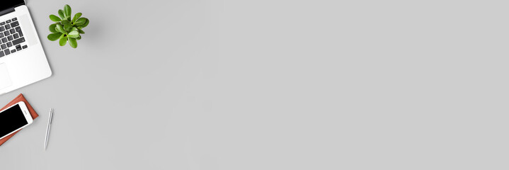 Concept of office desktop with laptop and accessories. Business background with copyspace. Banner