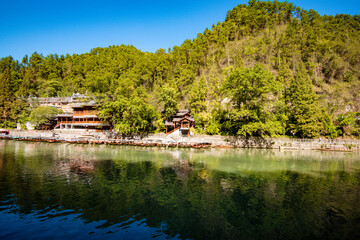 the river, the boat, stone bridge and the old houses at ancient phoenix town in the morning at Hunan, China.